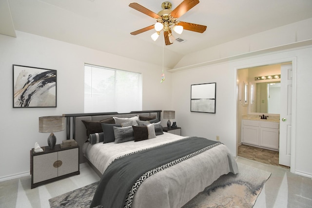 6007 Gideon Ct, Sugar Land, TX 77479 - bedroom featuring baseboards, a sink, ensuite bath, and vaulted ceiling