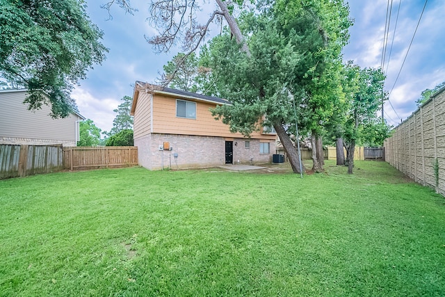 20211 Big Timber Ct, Humble, TX 77346 - rear view of house with central AC and brick siding
