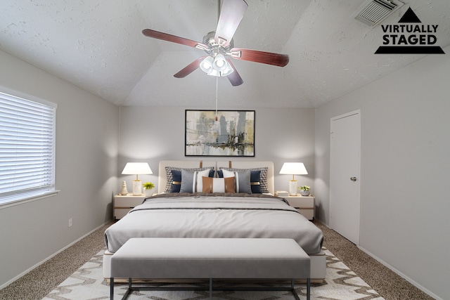 20211 Big Timber Ct, Humble, TX 77346 - bedroom with light carpet, a textured ceiling, ceiling fan, and baseboards