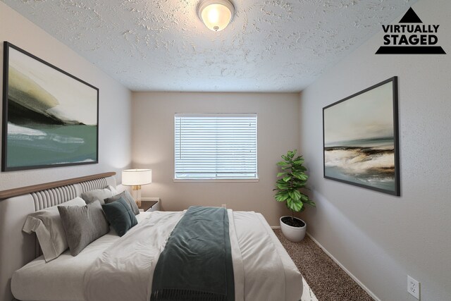 20211 Big Timber Ct, Humble, TX 77346 - bedroom with a textured ceiling, carpet flooring, and baseboards
