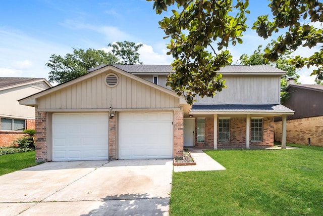 view of front facade featuring brick siding, a garage, driveway, and a front yard