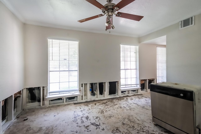 unfurnished room with ceiling fan and visible vents
