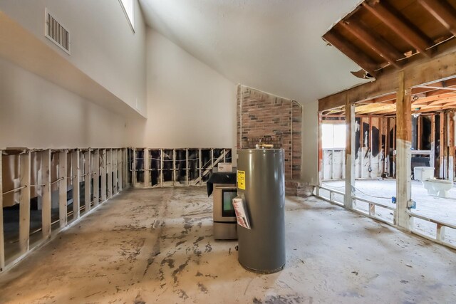miscellaneous room featuring visible vents and electric water heater