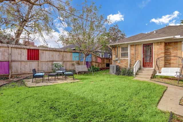 1106 Key St, Houston, TX 77009 - view of yard with central AC and a patio