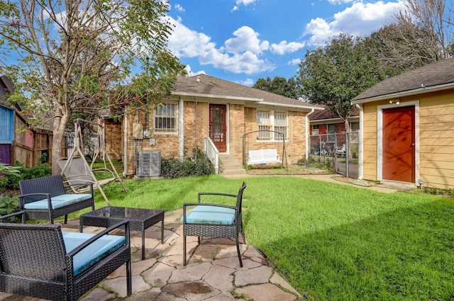 1106 Key St, Houston, TX 77009 - rear view of property with central AC unit, brick siding, a patio area, a shingled roof, and entry steps
