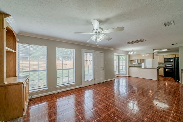 unfurnished living room featuring a textured ceiling, ceiling fan, visible vents, and baseboards