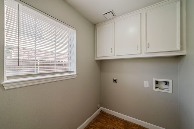 clothes washing area featuring cabinet space, washer hookup, baseboards, electric dryer hookup, and visible vents