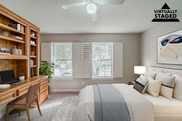 4122 Sablechase Dr, Houston, TX 77014 - bedroom featuring carpet floors, a desk, baseboards, a ceiling fan, and a textured ceiling