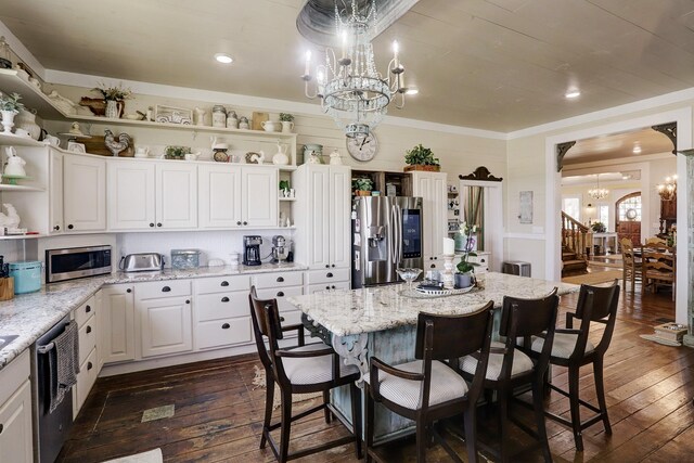 kitchen featuring an inviting chandelier, appliances with stainless steel finishes, open shelves, and dark wood-style flooring