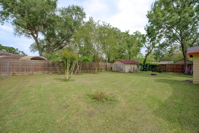 316 Hickman Ln, Angleton, TX 77515 - view of yard with a storage shed, an outbuilding, and a fenced backyard