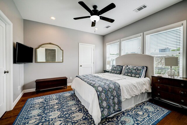 bedroom featuring baseboards, recessed lighting, wood finished floors, and visible vents