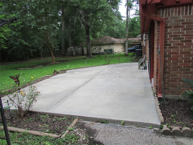 view of patio featuring fence