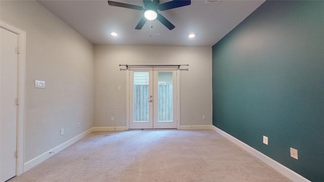unfurnished room with baseboards, recessed lighting, light colored carpet, french doors, and a ceiling fan