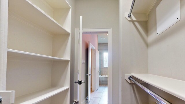 walk in closet featuring light tile patterned floors