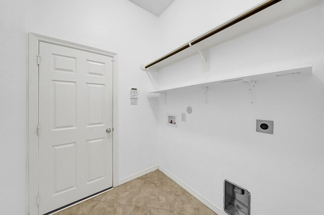 laundry area with laundry area, washer hookup, gas dryer hookup, baseboards, and hookup for an electric dryer
