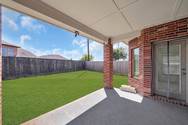view of yard with a patio and a fenced backyard