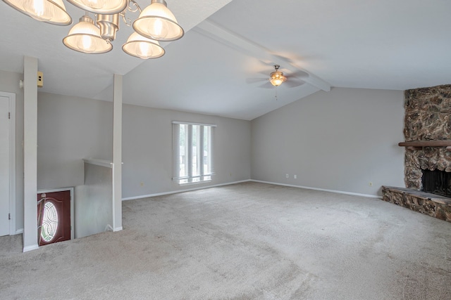 unfurnished living room with vaulted ceiling with beams, ceiling fan, and carpet floors
