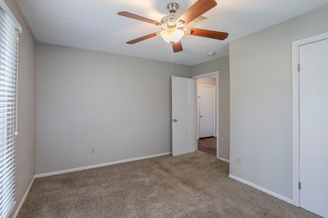 unfurnished bedroom featuring baseboards, ceiling fan, and carpet flooring
