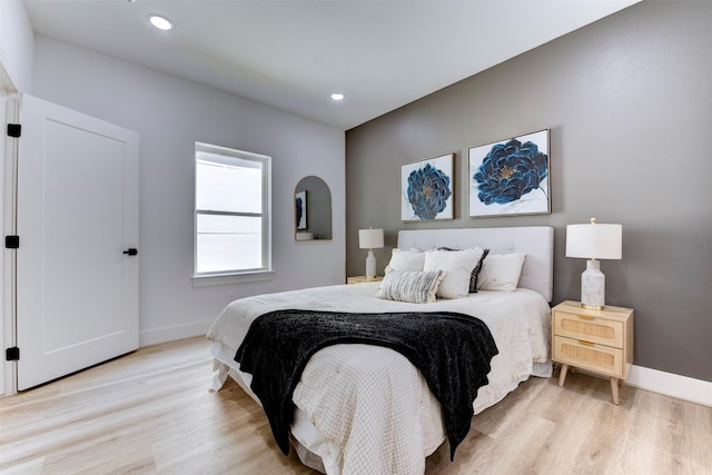 bedroom featuring recessed lighting, baseboards, and light wood-type flooring