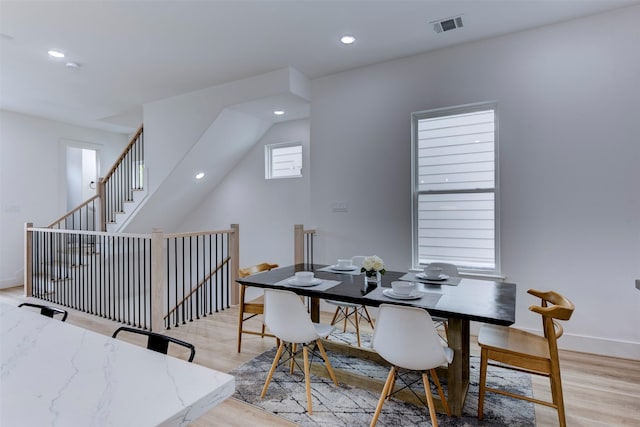 dining area featuring recessed lighting, baseboards, light wood-type flooring, and visible vents