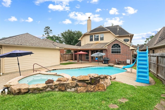 3714 Cedar Glen Ln, Spring, TX 77388 - view of swimming pool with a water slide, a fenced backyard, an in-ground hot tub, and a patio