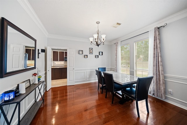 3714 Cedar Glen Ln, Spring, TX 77388 - dining area with a chandelier, crown molding, dark wood-type flooring, a decorative wall, and a wainscoted wall