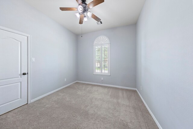 unfurnished room featuring baseboards, a ceiling fan, carpet flooring, and visible vents