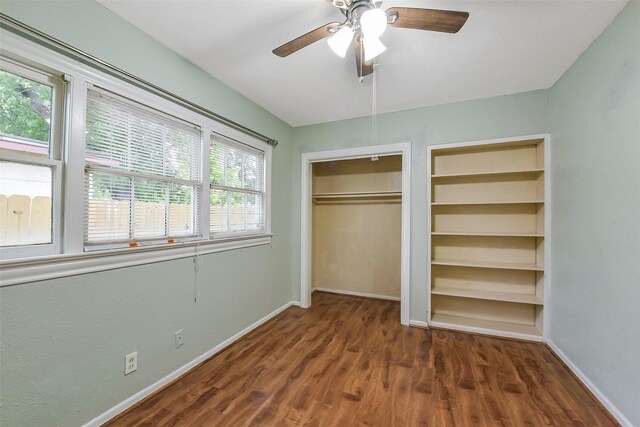 unfurnished bedroom featuring baseboards, a ceiling fan, and wood finished floors