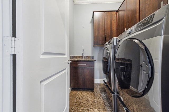 1033 Herkimer St, Houston, TX 77008 - clothes washing area with baseboards, marble finish floor, cabinet space, and independent washer and dryer