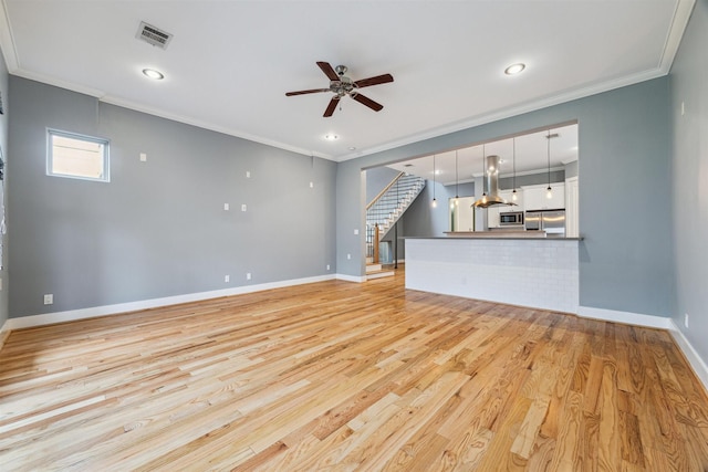 1033 Herkimer St, Houston, TX 77008 - unfurnished living room with visible vents, ornamental molding, baseboards, ceiling fan, and light wood finished floors