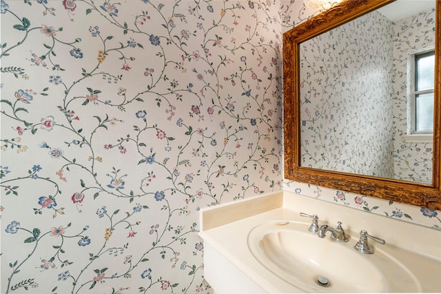 605 N Rivershire Dr, Conroe, TX 77304 - bathroom with wallpapered walls and a sink