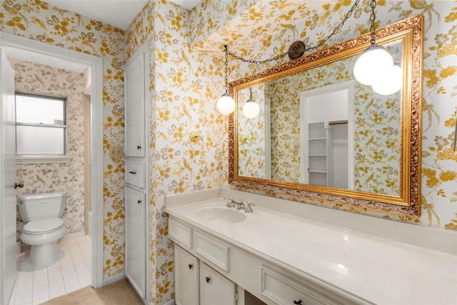 605 N Rivershire Dr, Conroe, TX 77304 - full bathroom featuring tile patterned flooring, a closet, toilet, and vanity
