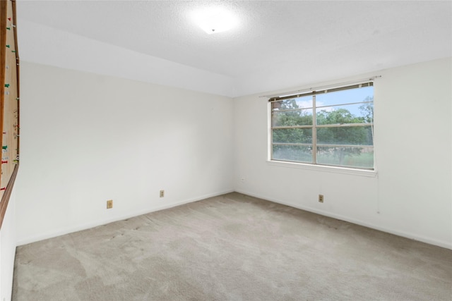 605 N Rivershire Dr, Conroe, TX 77304 - spare room featuring carpet floors and baseboards