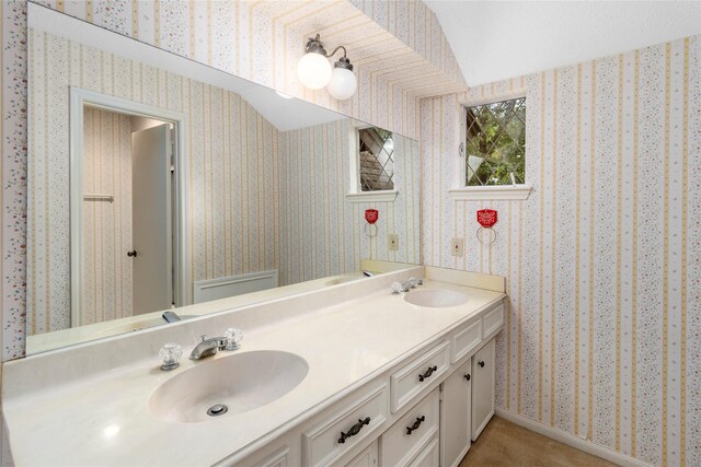 605 N Rivershire Dr, Conroe, TX 77304 - full bath featuring double vanity, wallpapered walls, and a sink