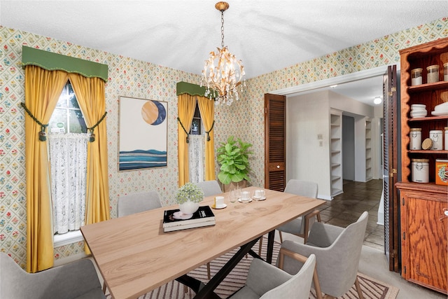 605 N Rivershire Dr, Conroe, TX 77304 - dining area featuring an inviting chandelier, wallpapered walls, and a textured ceiling