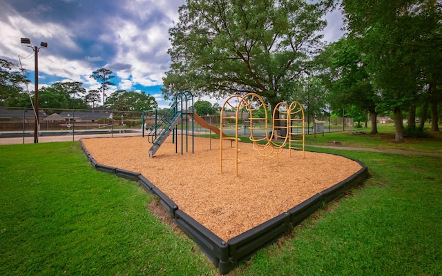 605 N Rivershire Dr, Conroe, TX 77304 - communal playground featuring a lawn and fence