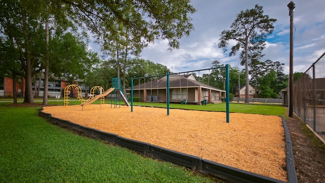 605 N Rivershire Dr, Conroe, TX 77304 - view of home's community with a lawn, fence, and playground community