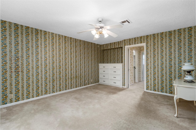605 N Rivershire Dr, Conroe, TX 77304 - unfurnished bedroom with ceiling fan, light colored carpet, a textured ceiling, and visible vents