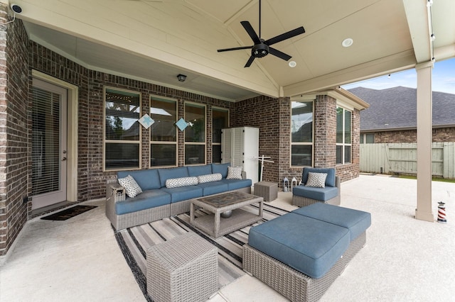 view of patio / terrace with ceiling fan, fence, and outdoor lounge area