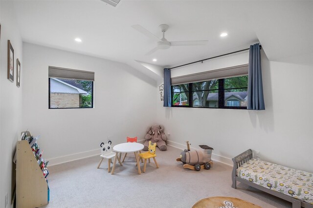 living area with carpet floors, recessed lighting, and a healthy amount of sunlight