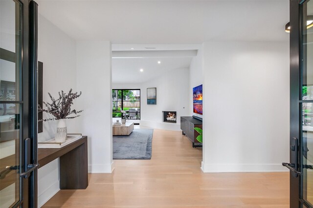 foyer featuring baseboards, recessed lighting, and light wood-style flooring