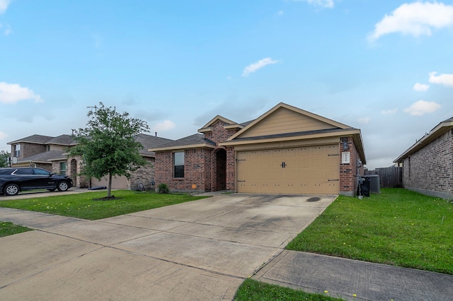 ranch-style house featuring brick siding, a garage, driveway, and a front lawn