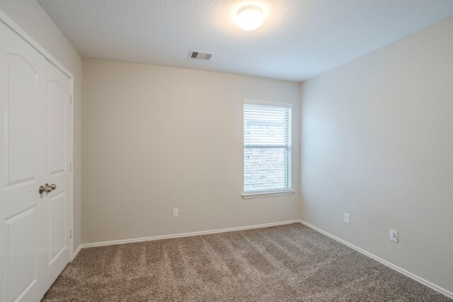 15459 Refugio Verde Way, Houston, TX 77049 - carpeted empty room featuring baseboards and visible vents
