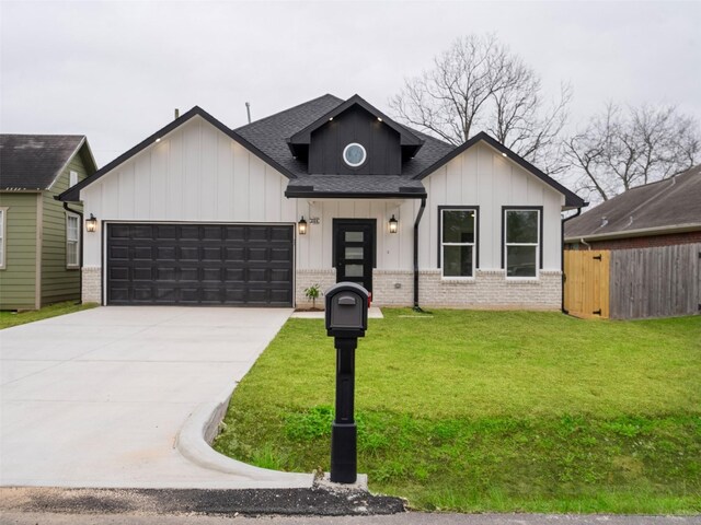 modern farmhouse with brick siding, a shingled roof, board and batten siding, an attached garage, and driveway