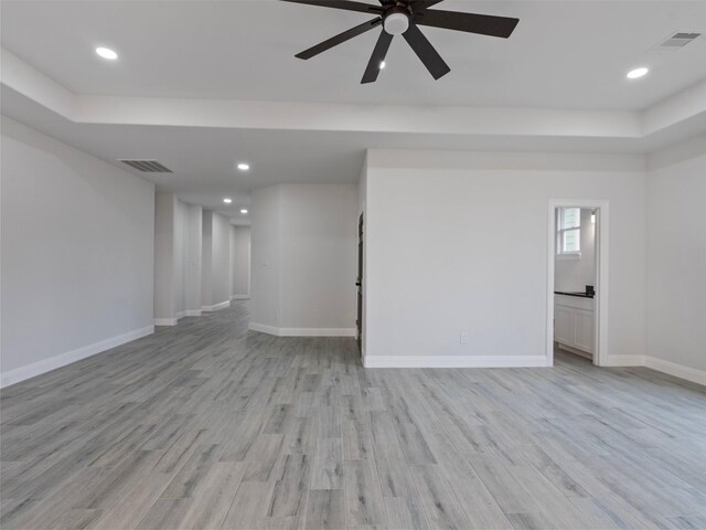 interior space featuring a ceiling fan, baseboards, recessed lighting, and light wood-type flooring