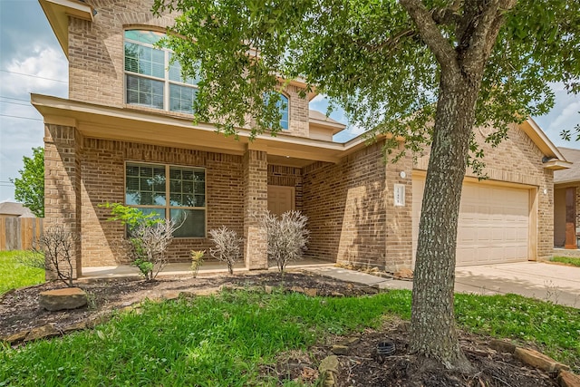 25451 Dappled Filly Dr, Tomball, TX 77375 - traditional-style house with a porch, brick siding, an attached garage, and driveway