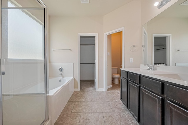25451 Dappled Filly Dr, Tomball, TX 77375 - full bath featuring a walk in closet, a shower with shower door, vanity, toilet, and a bath