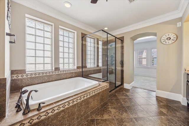 full bathroom featuring a garden tub, crown molding, a shower stall, baseboards, and recessed lighting