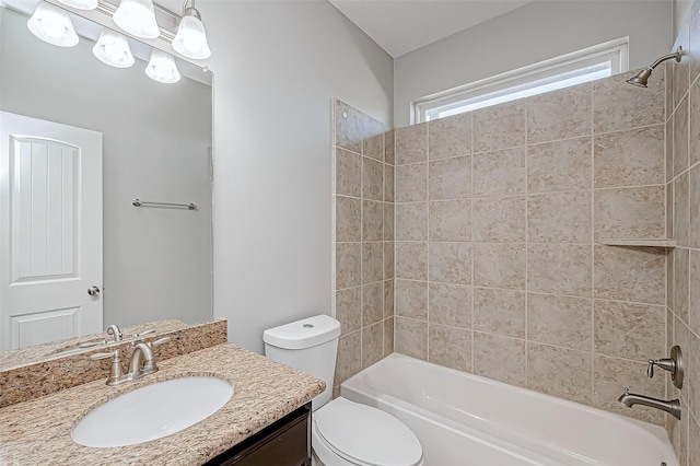 bathroom featuring toilet, washtub / shower combination, and vanity