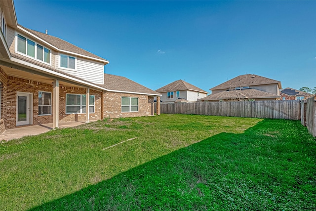 view of yard featuring a fenced backyard and a patio area